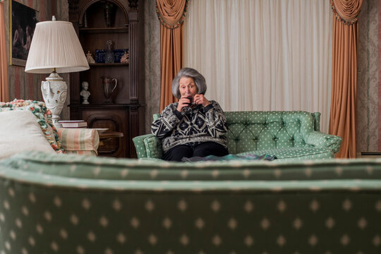 Grandma having coffee in the nice room