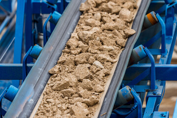 Industrial belt conveyor moving raw materials from mine
