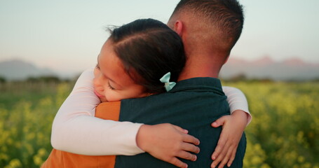 Father, child and hug for love in nature for bonding, care and quality time together in the...