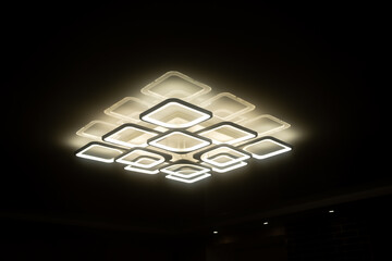 Led lamps built into the ceiling glowing in the dark