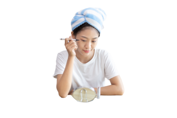 Asian woman putting her hair in a towel and putting on makeup to get ready for work, Make up brush,  After taking a shower in the morning, Beautify, Facial care and cosmetics, Make up mirror.