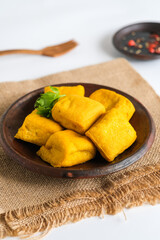 fried yellow tofu in plate