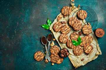 Homemade Nut Cookies with Chocolate and Cocoa. On the pastry table. Top view, space for text.