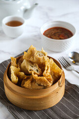 batagor is Indonesian dish like fried dumplings, served in peanut sauce and chili