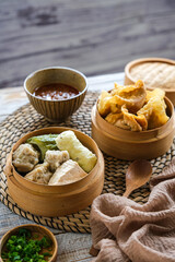 siomay and batagor is Indonesian traditional food, steamed and fried dumpling with peanut sauce