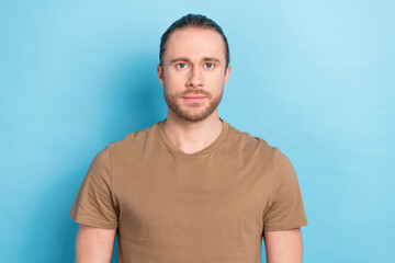 Portrait photo of serious confident businessman entrepreneur worker wear brown t-shirt professional programmer isolated on blue color background