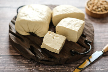 white tofu on a cutting board. raw food