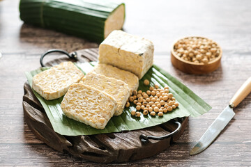 raw tempe or tempeh is a traditional  Indonesian food made from fermented soybeans.. Tempeh wrapped...