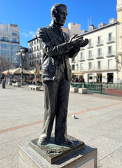 Historical statue of the famous poet, Federico García Lorca with a pigeon on Saint Anne Square...