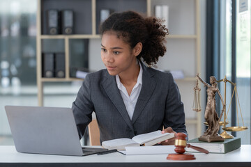 Judge gavel Justice lawyers, African American businesswoman in suit or lawyer working on a...