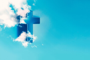Ascension day concept. Christian Easter. Shining cross in clouds on blue sky. Second coming of Christ. Faith in Jesus Christ. Christianity. Church worship, salvation, Easter concept - 579663945