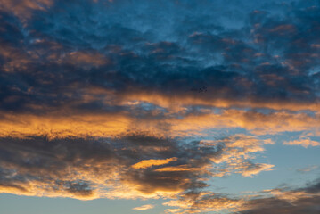 Naklejka na ściany i meble Sunset clouds with beautiful colors