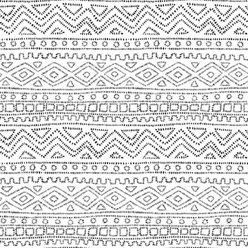 Cute geometric seamless pattern in polka dot style. Ethnic and tribal motifs. Abstract black and white background. Vector illustration.