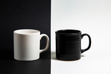 white cup on black and black cup on white background