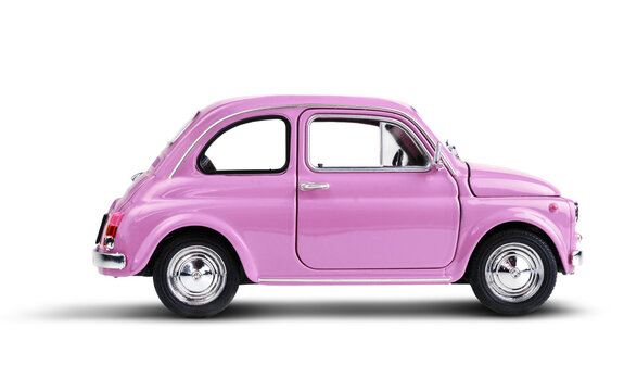 Pink vintage toy car isolated on white background