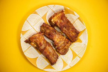 barbecue pork ribs on a plate on a bright background