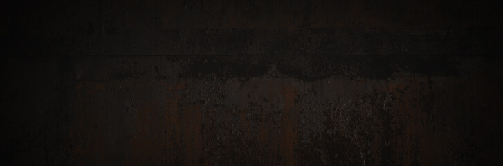 Old rusted metal texture. Rusty iron wall. Rough faded metal surface with spots, noise and grain. Dark wide panoramic background for grunge design. Shaded vintage texture with vignette.
