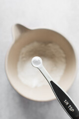 A teaspoon of baking soda or baking powder