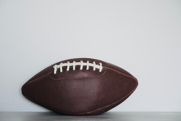 Rugby ball with white background. American soccer sport. Ball with space for text.