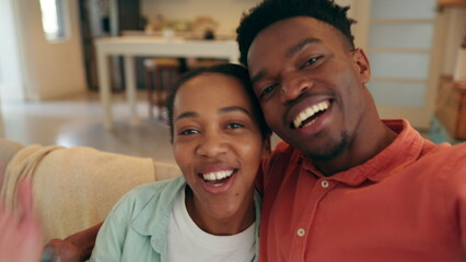 Video call, wave and love with a black couple laughing together while talking on a call in their home. Happy, communication and smile with a young man and woman having fun and calling with technology