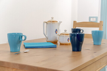 blue jug and cup of coffee