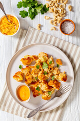 baked Cauliflower florets with sauce on plate