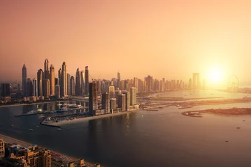 Foto auf Acrylglas Dubai skyline on sunset, modern city with skyscrapers © Maresol