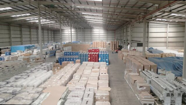 Tracking shot of huge white warehouse space in India