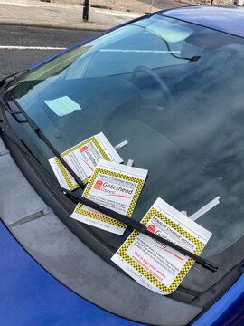 Gateshead UK: 26th Sept 2021: Multiple parking tickets on a car windscreen
