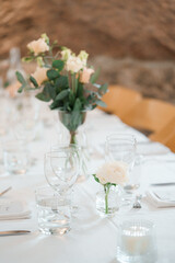 wedding table decoration with flowers and cutlery on table. Still life floral arrangement 