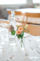 wedding table decoration with flowers and cutlery on table