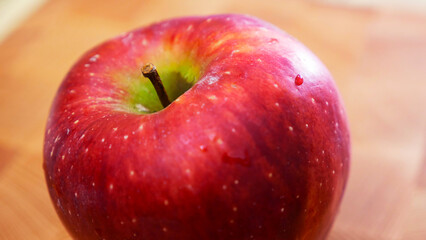 red apple with water drops