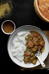 Asian curry and rice with vegetables.