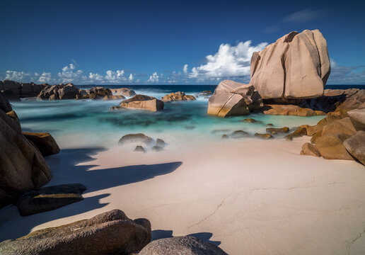 Granite rocks on a beautiful tropical beach in turquoise water in Seychelles