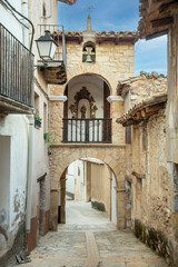 Fototapeta na wymiar Chapel of San Antonio in a doorway in the Teruel village of Fuentespalda, Teruel, Spain. Rural tourism concept