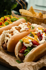 Hot dogs with sausage and variety of vegetable with sauces