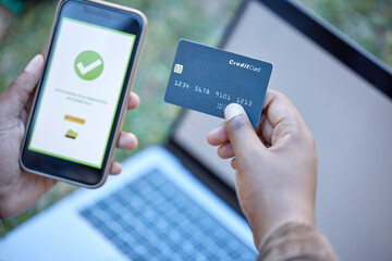 Credit card, phone banking app and approval check on a mobile website payment with laptop mockup....