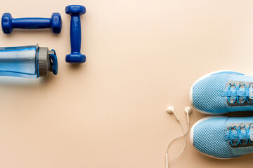 Gym and fitness equipment and workout tools with sneakers and dumbbells