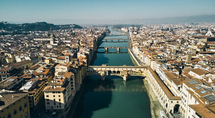 Fototapeta premium Aerial view of Ponte Vecchio bridge and Arno river in Florence. High quality photo