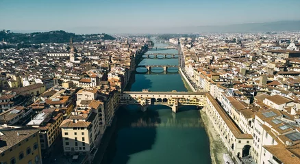 Photo sur Plexiglas Ponte Vecchio Aerial view of Ponte Vecchio bridge and Arno river in Florence. High quality photo