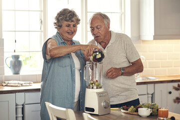 Today were making smoothies. Shot of a senior couple making a smoothie in the kitchen at home.