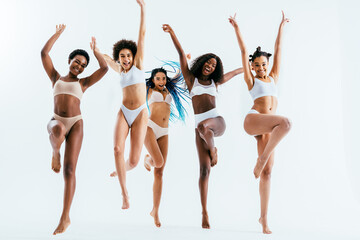 Beautiful black women wearing lingerie underwear posing in studio - Multicultural female models...