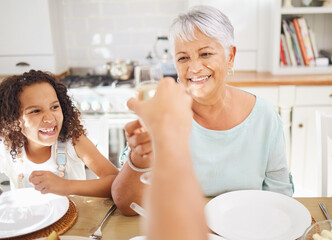Champagne toast and grandmother for mothers day celebration in home kitchen dining room with children. Happy elderly person with wine glass celebrate mothersday, birthday or happy lifestyle with kid