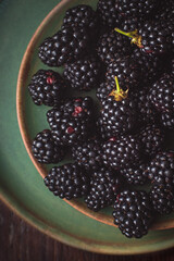 blackberries on a green plates