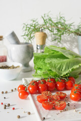 vegetables and spices. Cherry tomatoes, lettuce leaves and various spices. Red, green and black pepper.