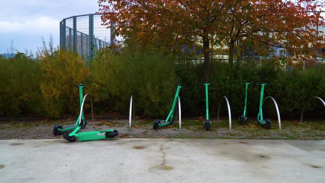 Green Electric Scooters Lying on the Street