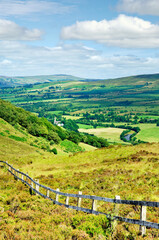Sperrin Mountains, County Tyrone, Ireland. North over Gortin village in valley of the Owenkillew River east of Newtownstewart