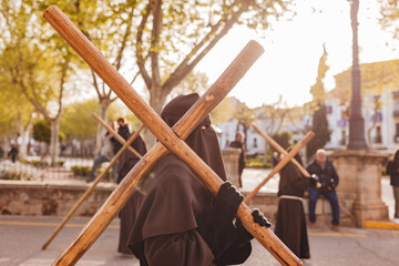 Fototapeta na wymiar nazarene with a cross in procession