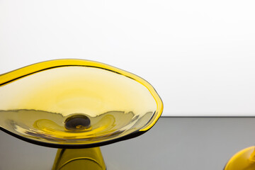 Abstract yellow glass installation, fragment of transparent decoration