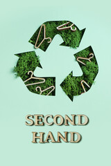 Second hand text and green moss under paper cut recycling symbol. Save planet, eco, recycling cloth concept
